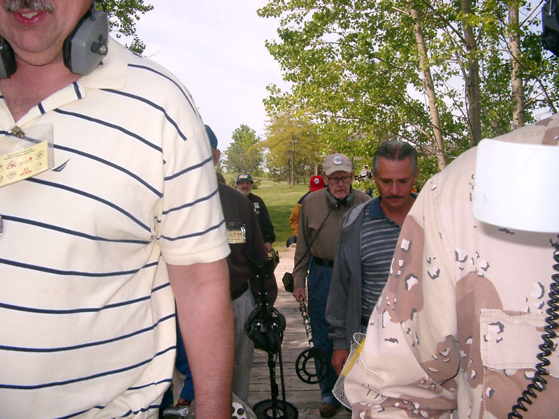 Participants walking on the boardwalk to the Hunt Field
